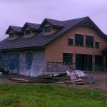 A large house under construction, showcasing ongoing building activity.